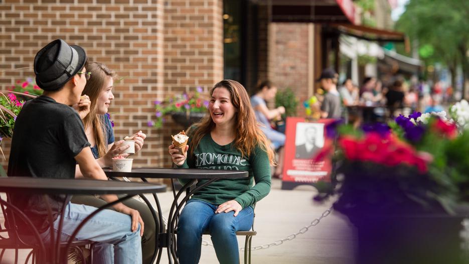 Three students have ice cream in downtown Saratoga Springs