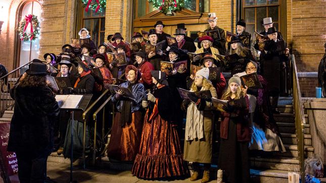 A choir of victorian-dressed people